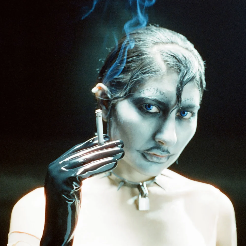 Esfandiari holding a cigarette